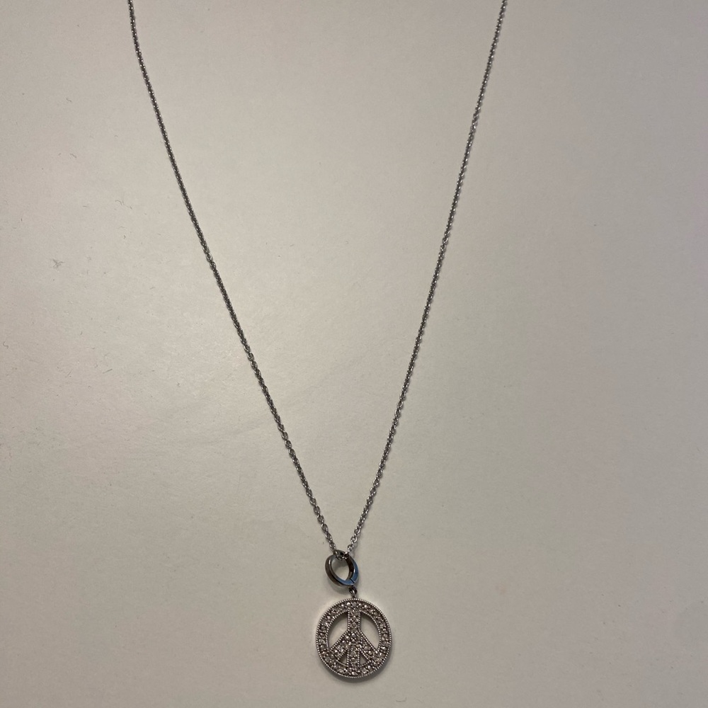 Never worn. Semi precious, peace sign necklace.